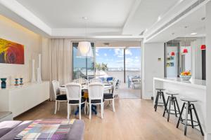 a dining room and kitchen with a table and chairs at City Penthouse in Larnaca