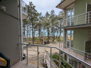 a view from the balcony of a building with trees in the background at Panorama hotel kobuleti in Kobuleti