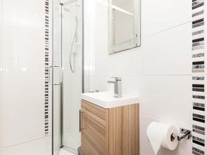 a bathroom with a sink and a mirror at 3 Bed in Inverness oc-in633 in Balnain +16 photos