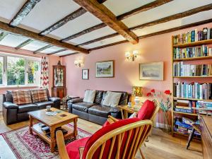 a living room with a couch and a table at 3 Bed in Keswick oc-sz047 in Threlkeld