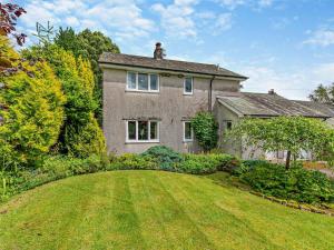 a large brick house with a large yard at 3 Bed in Keswick oc-sz047 in Threlkeld
