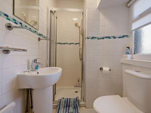 a bathroom with a sink and a toilet and a shower at 3 Bed in Lochgelly oc-ff224 in Kinglassie +26 photos