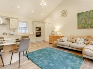 a living room with a couch and a table at 2 Bed in Swansea oc-91725 in Killay