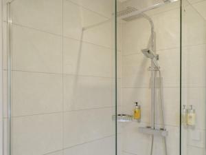 a bathroom with a shower with a glass door at 2 Bed in Swansea oc-91725 in Killay +12 photos