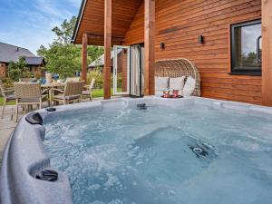a hot tub in front of a house at 3 Bed in Swansea oc-91721 in Killay