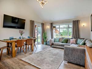 a living room with a couch and a table at 3 Bed in Swansea oc-91721 in Killay