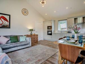a living room with a couch and a table at 3 Bed in Swansea oc-91721 in Killay