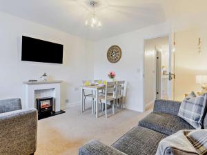 a living room with a couch and a table at 2 Bed in Keswick oc-91901 in Keswick
