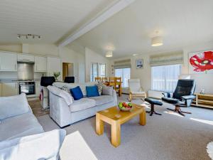 a living room with a couch and a table at 2 Bed in Narberth oc-91799 in Stepaside