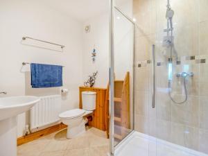 a bathroom with a shower and a toilet and a sink at 3 Bed in Appleby-in-westmorland oc-93200 in Colby +15 photos