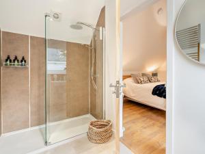 a bathroom with a shower and a bedroom at 4 Bed in Aberdeen oc-93914 in Dyce +40 photos