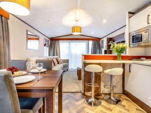 a kitchen and living room with a table and chairs at 2 Bed in St. Andrews oc-90763 in St. Andrews
