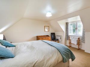a bedroom with a bed and a window at 3 Bed in Archiestown oc-ca227 in Carron