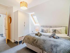 a bedroom with a large bed with two pillows on it at 3 Bed in Callander oc-79359 in Callander