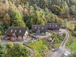 an aerial view of a house in a mountain at 3 Bed in Callander oc-79359 in Callander