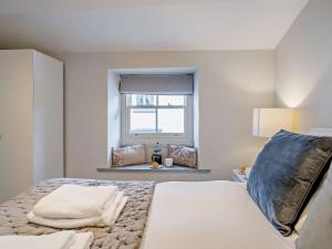 a bedroom with a bed and a window at 2 Bed in Grange-over-sands oc-73154 in Cartmel