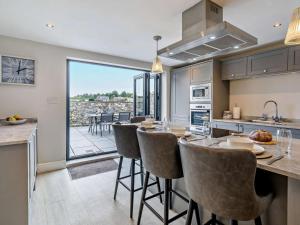 a kitchen and dining room with a table and chairs at 2 Bed in Grange-over-sands oc-73154 in Cartmel
