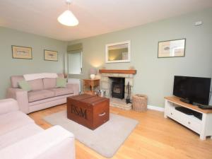 a living room with a couch and a fireplace at 2 Bed in Duns oc-48811 in Duns +3 photos