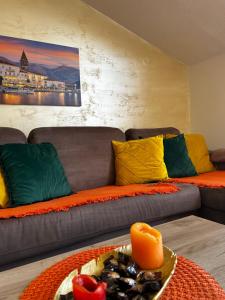 a living room with a couch and a table at Apartmani Gušti in Kamenari