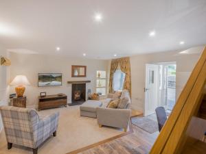 a living room with couches and a fireplace at 1 Bed in Grange-over-sands oc-78659 in Cartmel