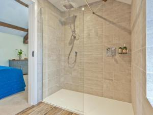 a shower with a glass door in a bathroom at 1 Bed in Grange-over-sands oc-78659 in Cartmel +9 photos