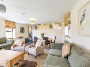 a living room with a couch and chairs and a table at 1 Bed in Lochgilphead oc-ca304 in Lochgilphead