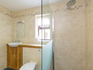 a bathroom with a shower and a toilet and a sink at 1 Bed in Lochgilphead oc-ca304 in Lochgilphead +13 photos