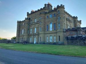 a large building with grass in front of it at 1 Bed in Girvan oc-78071 in Girvan