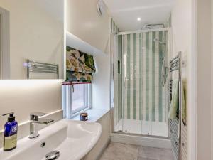 a white bathroom with a sink and a shower at 1 Bed in Gateshead oc-95877 in Lamesley +22 photos
