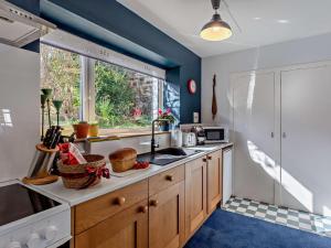 a kitchen with a sink and a window at 1 Bed in Buckie oc-94536 in Cullen