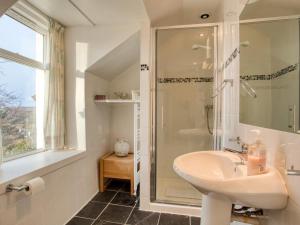 a bathroom with a sink and a shower at 4 Bed in Isle Of Skye oc-ca363 in Glendale +19 photos
