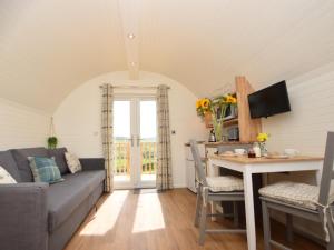 a living room with a couch and a table at 1 Bed in Hawick oc-75347 in Hawick