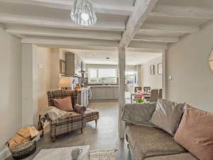a living room with two couches and a kitchen at 2 Bed in Grange-over-sands oc-89206 in Cartmel