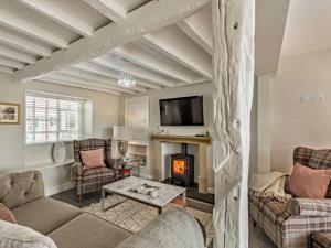 a living room with a couch and a fireplace at 2 Bed in Grange-over-sands oc-89206 in Cartmel