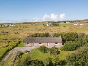 an aerial view of a house in a field at 2 Bed in Gairloch oc-ca137 in Big Sand