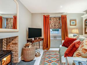 a living room with a couch and a television at 1 Bed in Duns oc-95832 in Duns