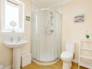 a bathroom with a shower and a toilet and a sink at 3 Bed in Isle Of Skye oc-81181 in Luib +23 photos