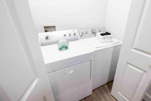 a white washer and dryer in a room at Maple Canyon w/Kitchen&wash+dry in Mount Pleasant