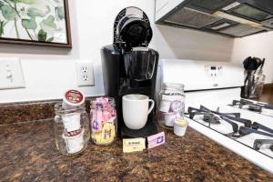 a coffee maker sitting on top of a kitchen counter at Maple Canyon w/Kitchen&wash+dry in Mount Pleasant