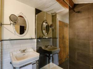 a bathroom with a sink and a mirror at 1 Bed in Grange-over-sands oc-89364 in Cartmel +6 photos