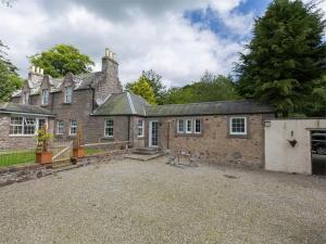 an old brick house with a large driveway at 1 Bed in Brechin oc-ca217 in Edzell
