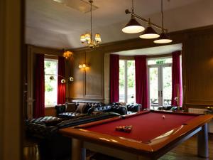 a living room with a pool table in it at 5 Bed in Lochgoilhead oc-ca279 in Carrick