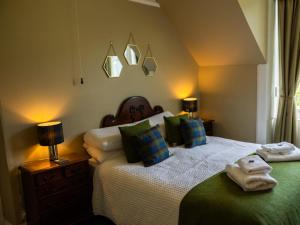 a bedroom with two beds with towels on them at 5 Bed in Lochgoilhead oc-ca279 in Carrick