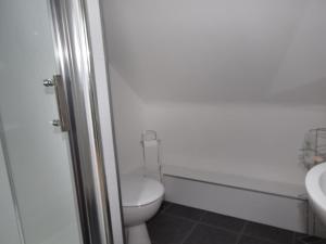a bathroom with a toilet and a sink at 3 Bed in Isle Of North Uist oc-77239 in Sollas +13 photos