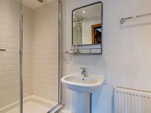 a bathroom with a sink and a shower and a mirror at 3 Bed in Grange-over-sands oc-95100 in Cark +21 photos