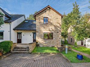 a stone house with a brick driveway at 3 Bed in Penrith oc-85896 in Penruddock
