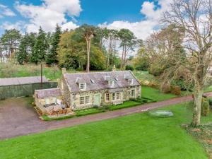 an aerial view of a house with a yard at 4 Bed in Ayr- oc-90038 in Ayr