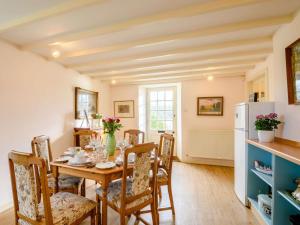 a kitchen and dining room with a table and chairs at 4 Bed in Ayr- oc-90038 in Ayr