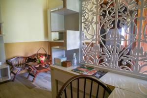 a kitchen with a wall with a design on it at Lembah Indah Malang in Gendogo