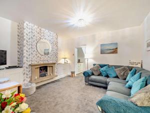 a living room with a couch and a fireplace at 2 Bed in Morecambe oc-93719 in Heysham